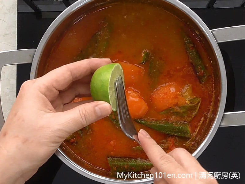 Adding Lime Asam Pedas (Spicy Tamarind Fish)