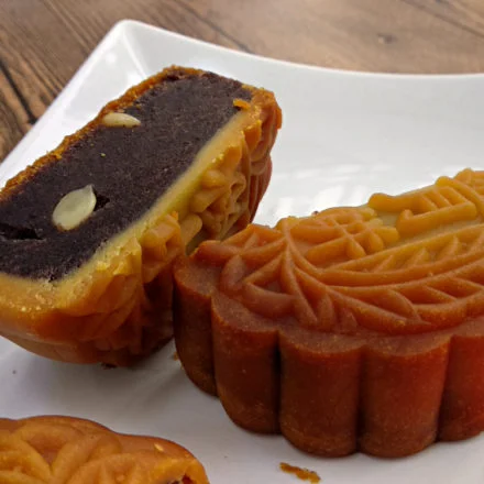 Top view of a chinese cake pastry with red bean paste filling inside, cut  into parts Stock Photo - Alamy